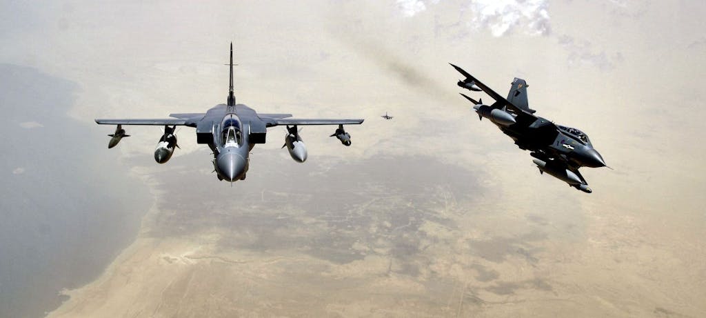 Two RAF Tornado GR-4s pull away from a KC-135 Stratotanker after refueling. (U.S. Air Force photo/Master Sgt. Lance Cheung)