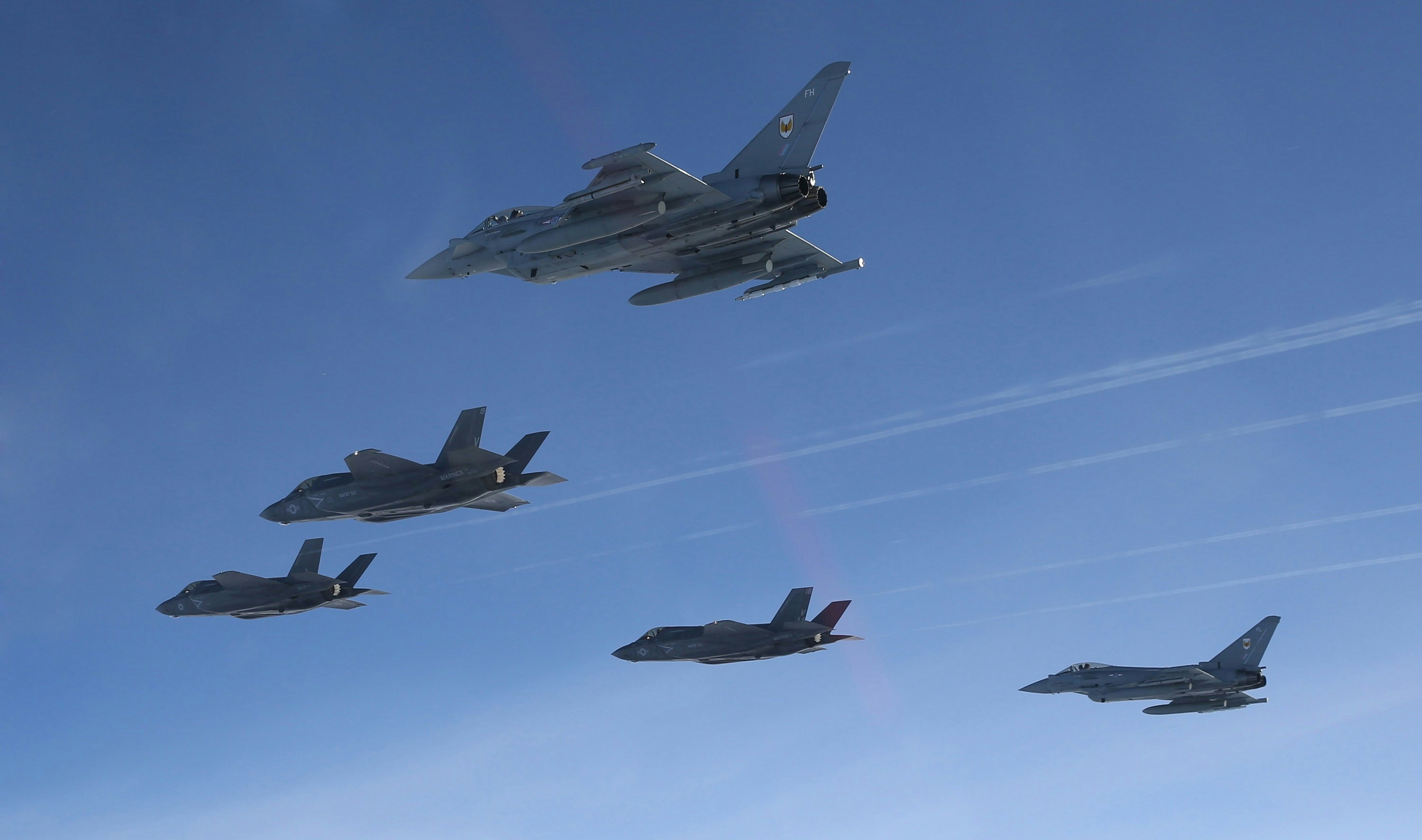 IN PICTURES: Typhoons escort F-35 into British airspace