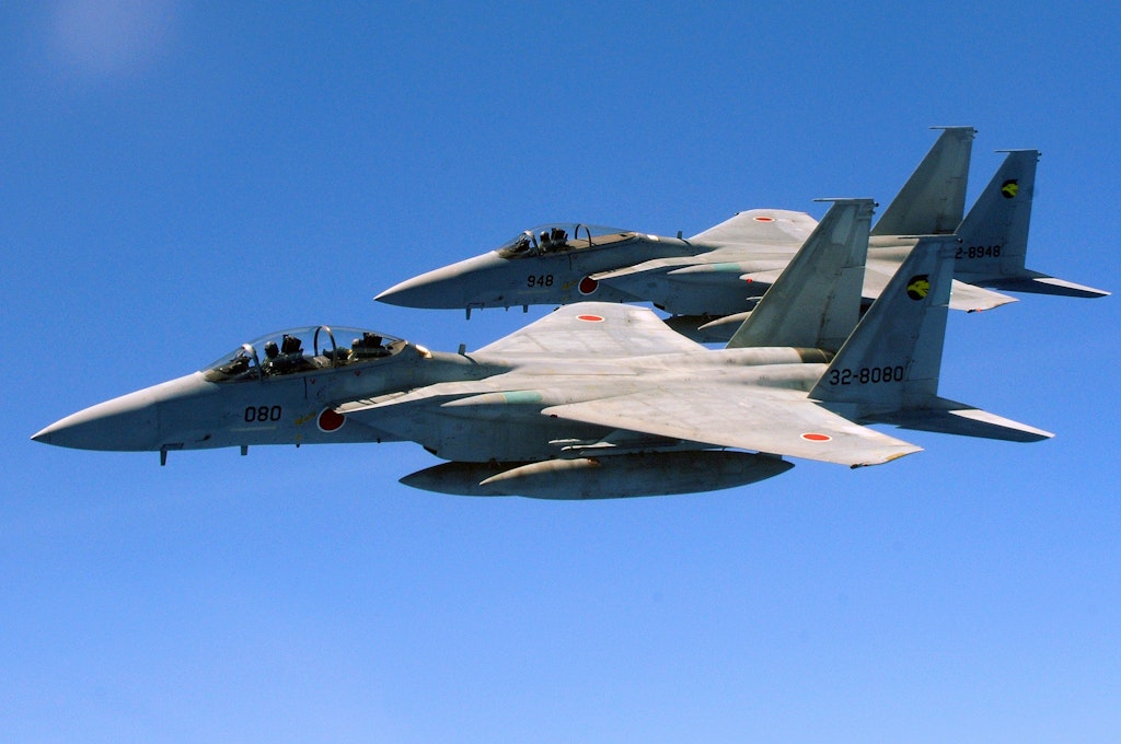 Two Japanese Air Self Defense Forces F-15's fly alongside a U.S. Air Force KC-135 from the 909th Air Refueling Squadron, Kadena Air Base, during air refueling training July 30. The training is in preparation for JASDF participation in Red Flag Alaska this year. (U.S. Air Force photo/Tech. Sgt. Angelique Perez)