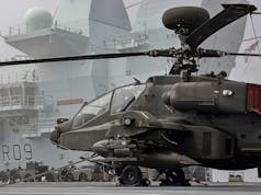 British carrier heads to sea with Apache gunships