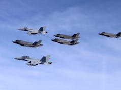 British and American carrier aircraft fly together