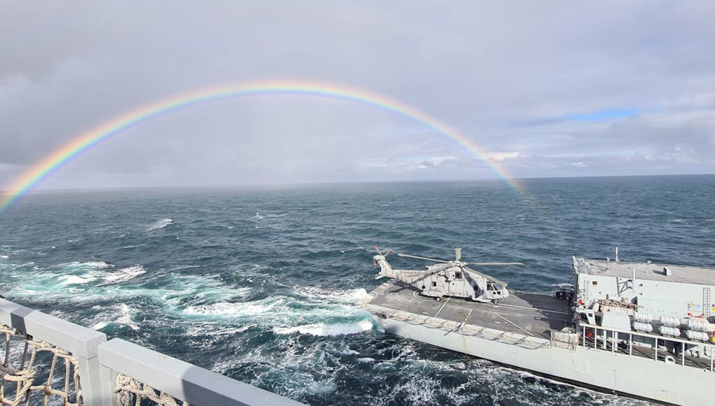 HMS Portlands Merlin Mk2 helicopter takes a break from patrols on the frigates flight deck