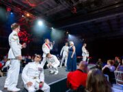 Carrier hangar transformed for Navy charity concert