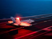 American supercarrier launches fighters off British coast
