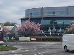 Three charged with terror offences after defence firm attack