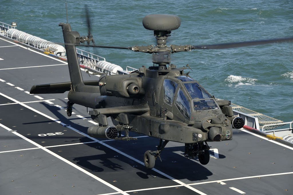 An Army Air Corps Apache attack helicopter takes off from the deck of HMS Ocean. (Open Government License)