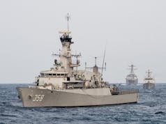 Indonesian navy fires on Chinese vessels, detains crew