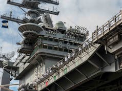 Supercarrier USS Nimitz and escort vessels deploy