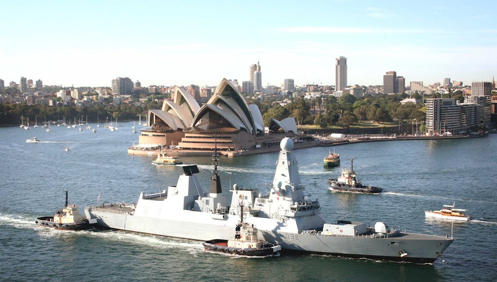 HMS Daring enters Sydney under the Sydney Harbour Bridge.