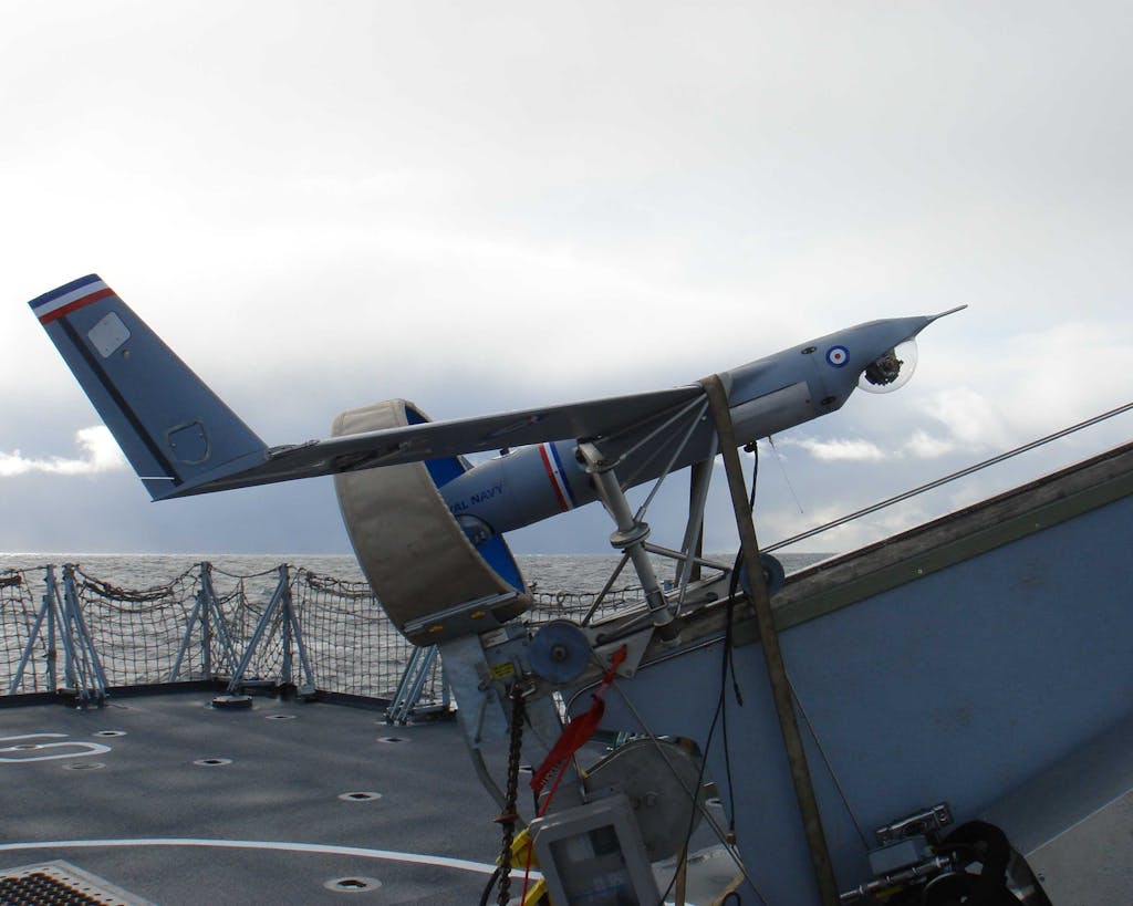 Royal Navy ScanEagle on its launcher in preparation for take-off from a frigate.