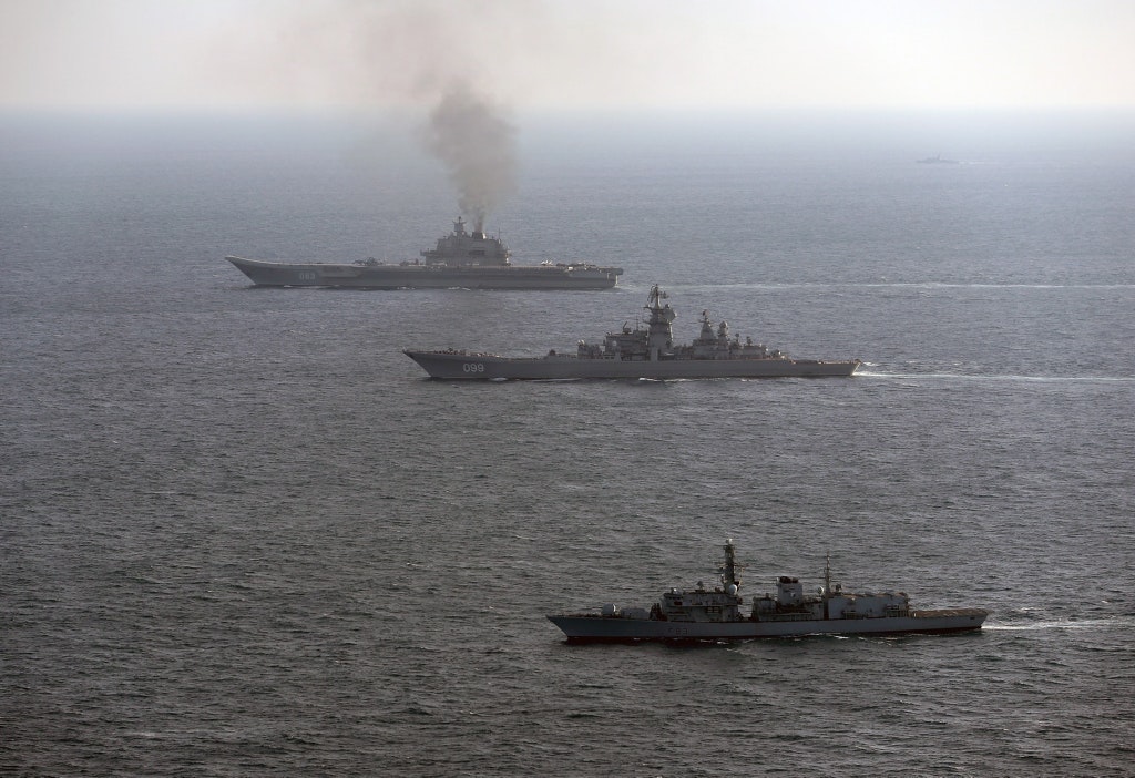 IN PICTURES: Russian Carrier Escorted By British Warships And Jets